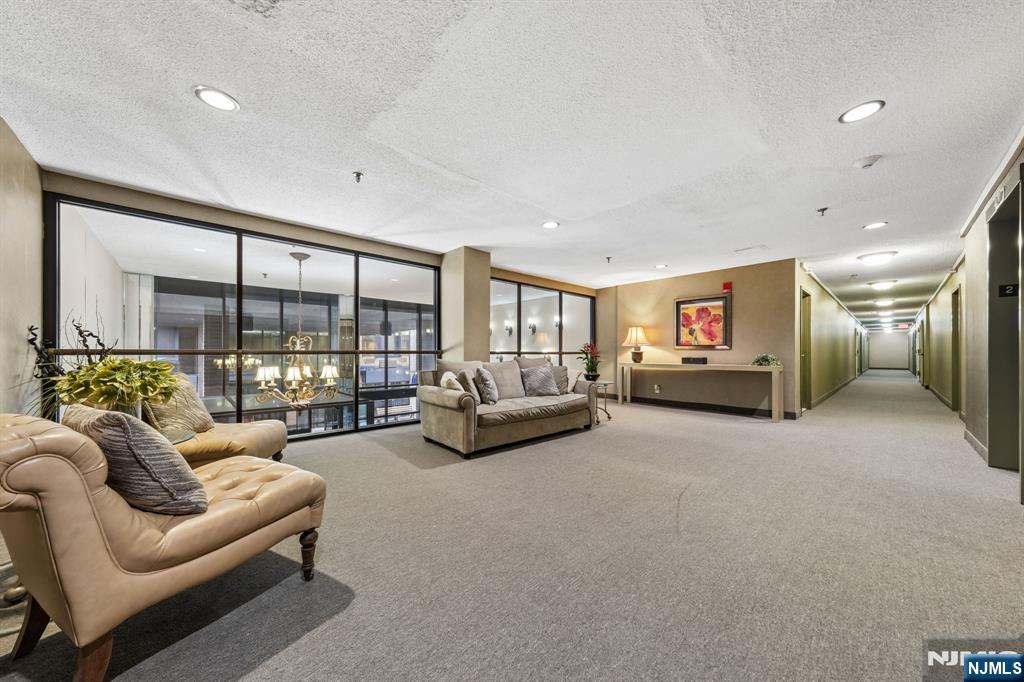 326 Prospect Avenue, Unit 10H Hackensack, NJ 07601 - Photo 24 of 31 a living room with furniture and a large window