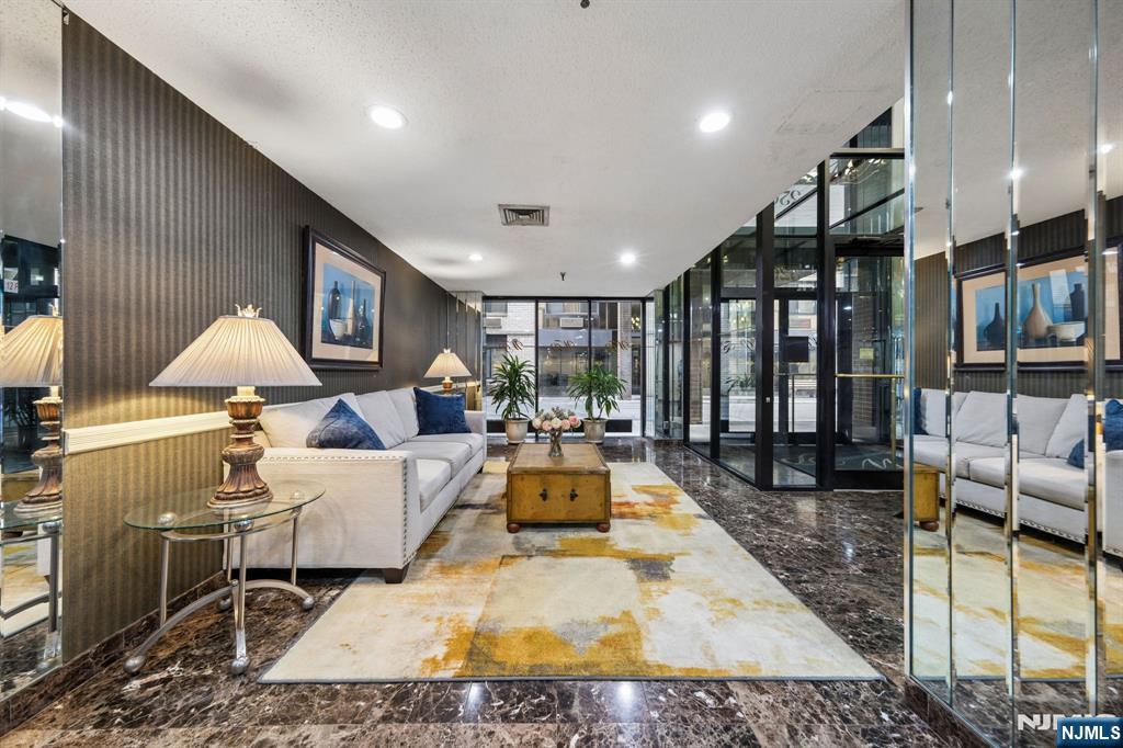 326 Prospect Avenue, Unit 10H Hackensack, NJ 07601 - Photo 28 of 31 a living room with furniture