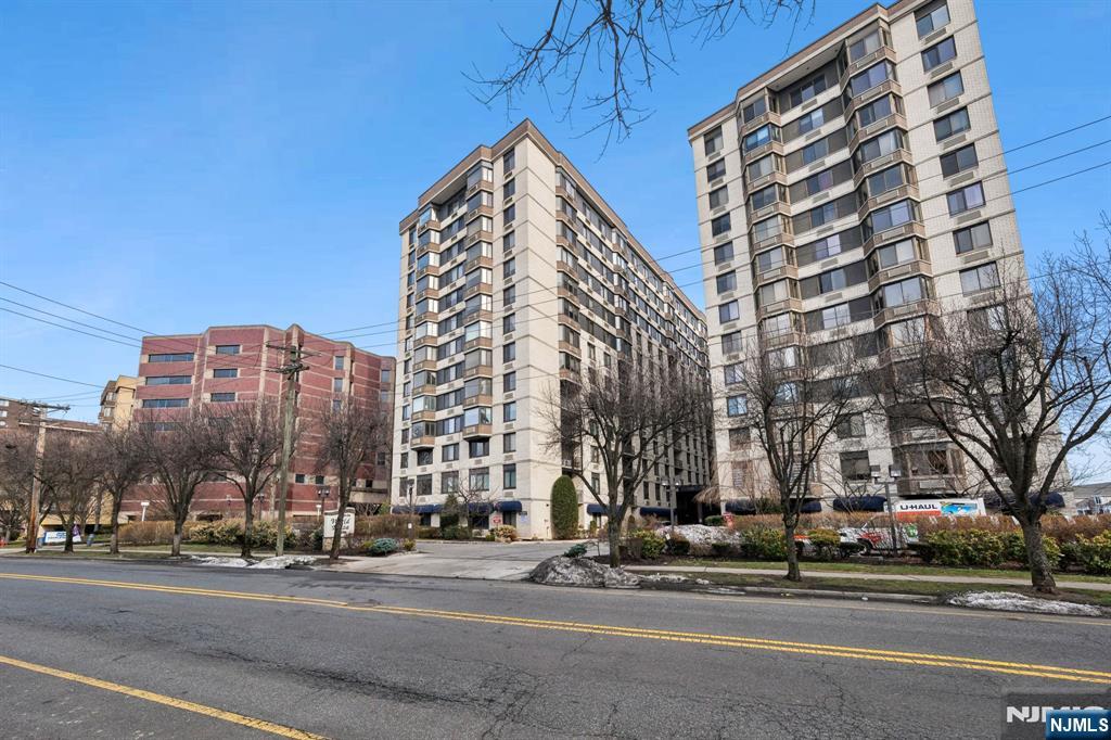 326 Prospect Avenue, Unit 10H Hackensack, NJ 07601 - Photo 30 of 31 a view of a tall building next to a road