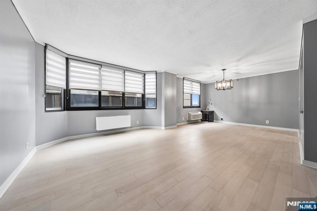 326 Prospect Avenue, Unit 10H Hackensack, NJ 07601 - Photo 7 of 31 a view of empty room with a kitchen