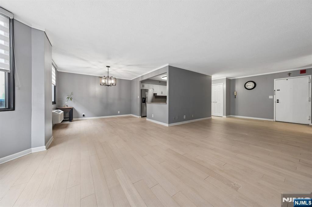 326 Prospect Avenue, Unit 10H Hackensack, NJ 07601 - Photo 8 of 31 a view of a big room with closet and windows