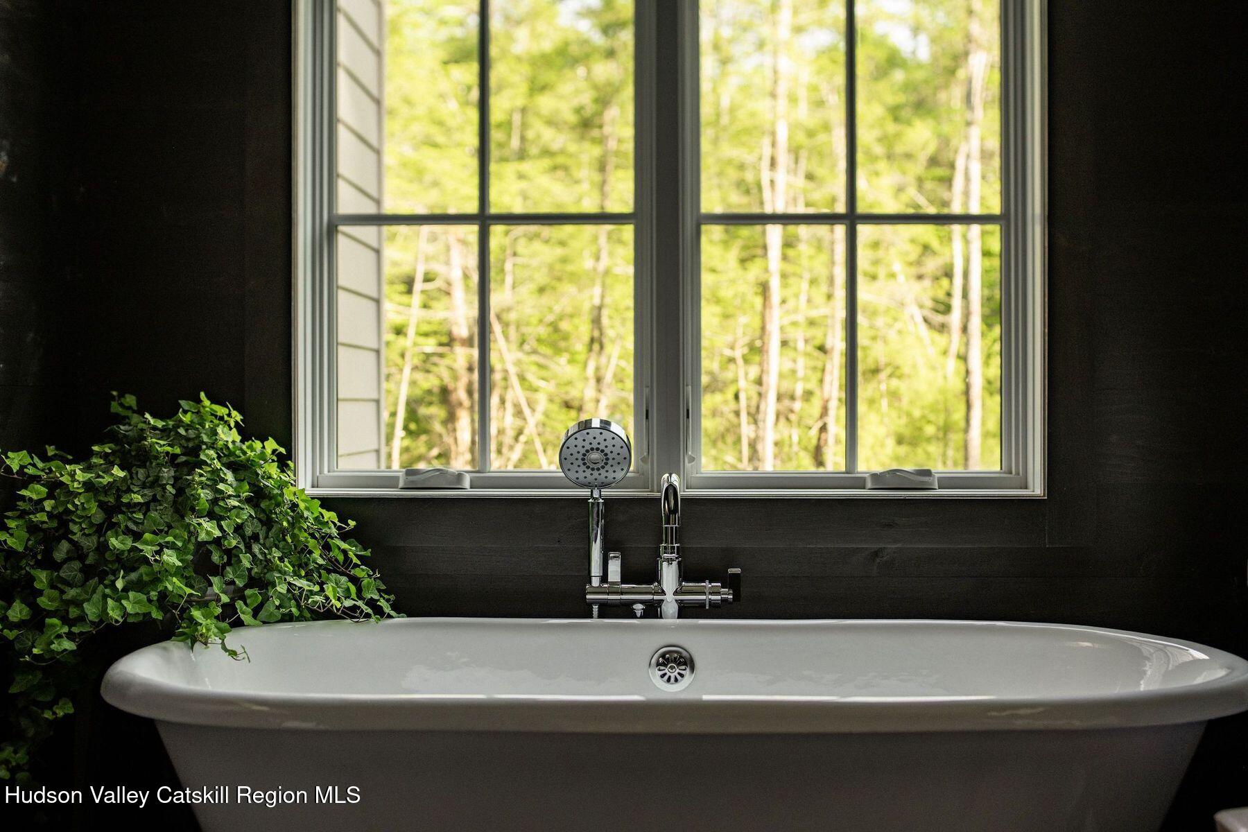 245 Brown Road Olivebridge, NY 12461 - Photo 24 of 44 a bathroom with a bathtub and window