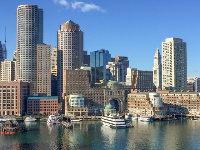 a view of water with tall building