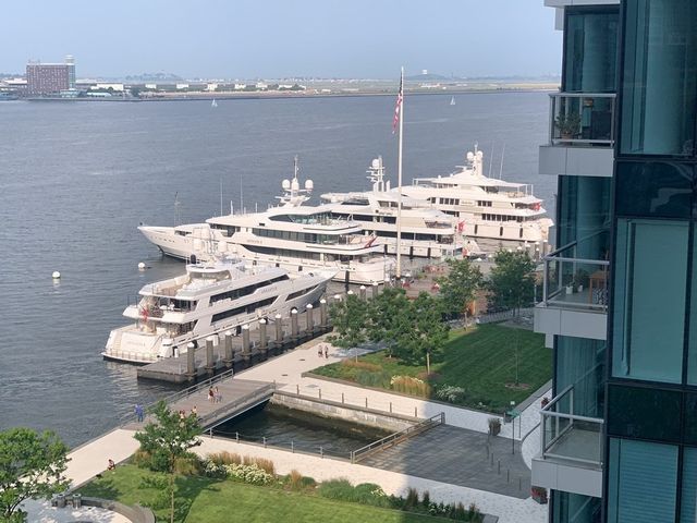 a terrace with outdoor seating and city view