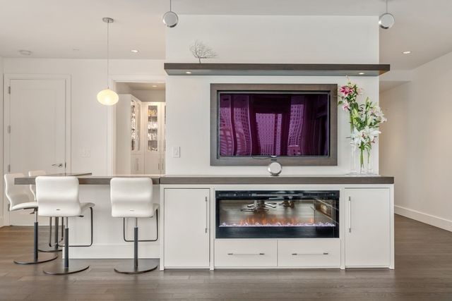 a stove top oven sitting inside of a kitchen