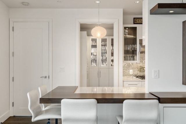 a view of a dining room with furniture and window