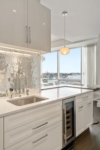 a kitchen with a window and cabinets