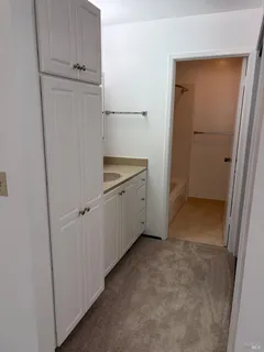 a view of cabinets and utility room