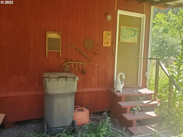 a view of bathroom with a chair and a table