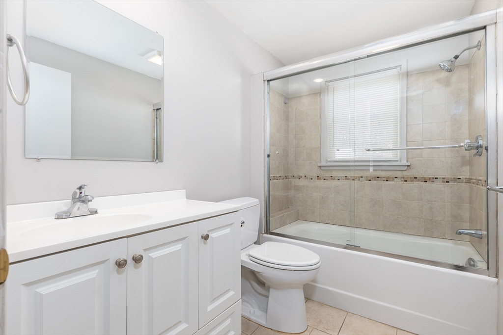 24 Pomeroy Road, Unit 24 North Reading, MA 01864 - Photo 14 of 21 a bathroom with a sink a toilet and shower