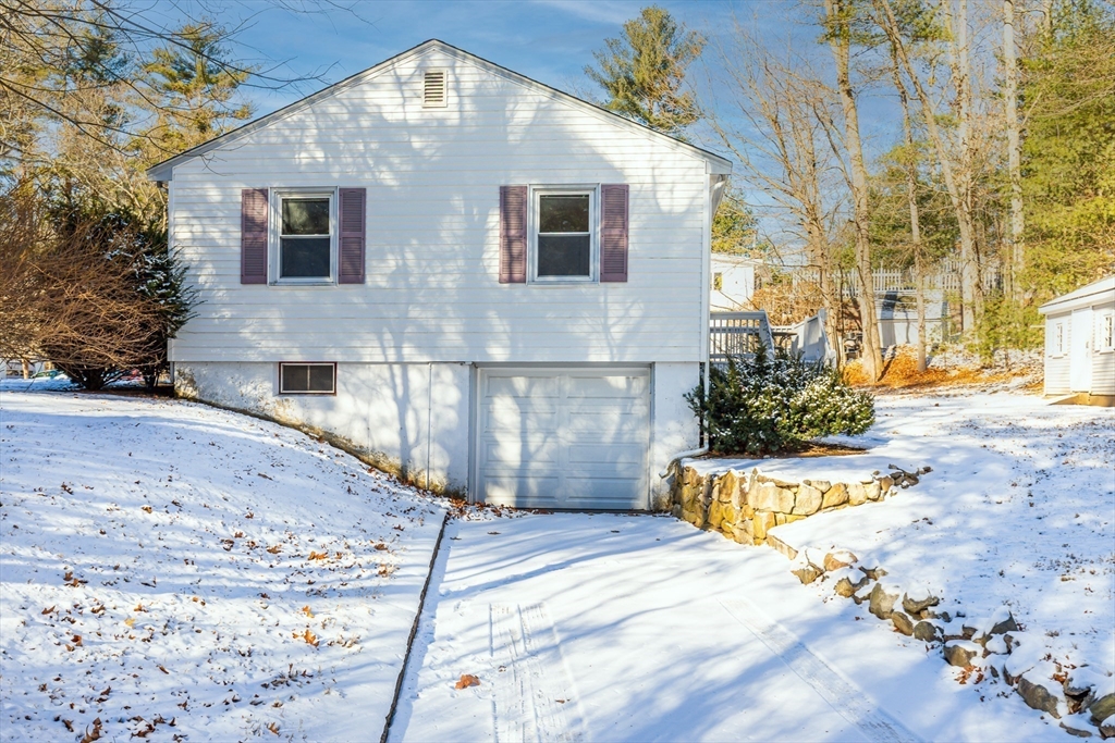 24 Pomeroy Road, Unit 24 North Reading, MA 01864 - Photo 19 of 21 a front view of a house with a yard