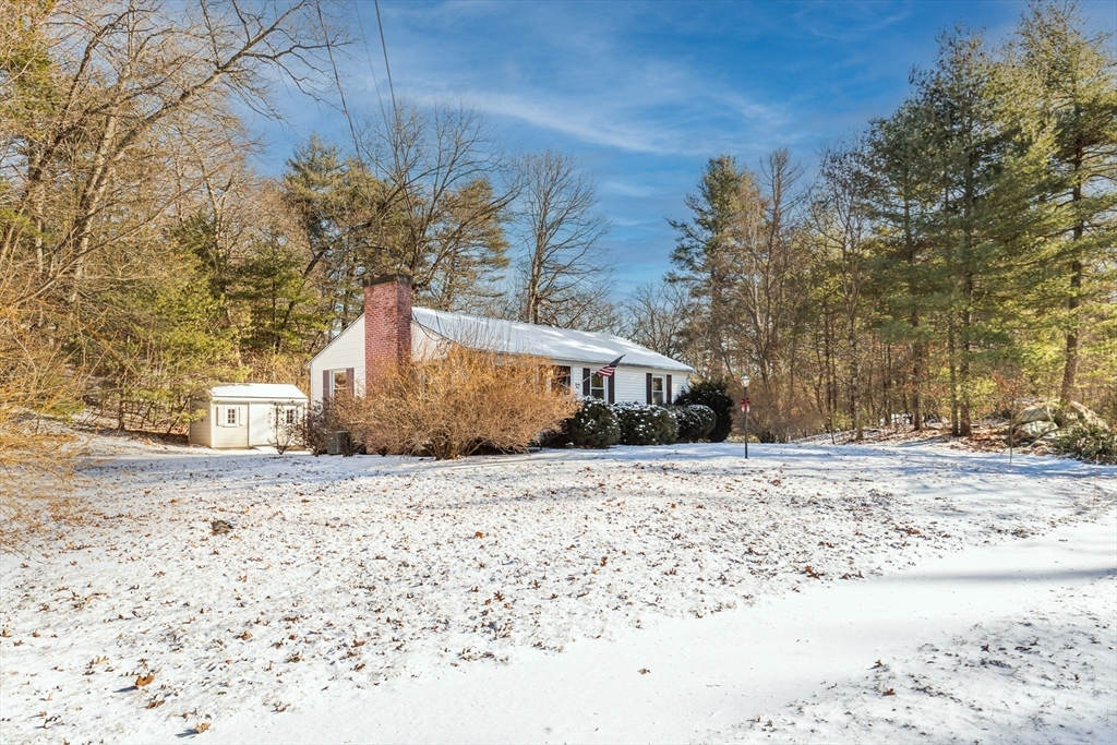24 Pomeroy Road, Unit 24 North Reading, MA 01864 - Photo 20 of 21 a front view of a house with a yard