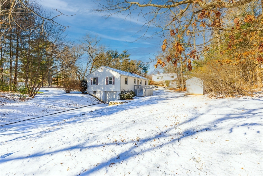 24 Pomeroy Road, Unit 24 North Reading, MA 01864 - Photo 21 of 21 a view of road with large trees