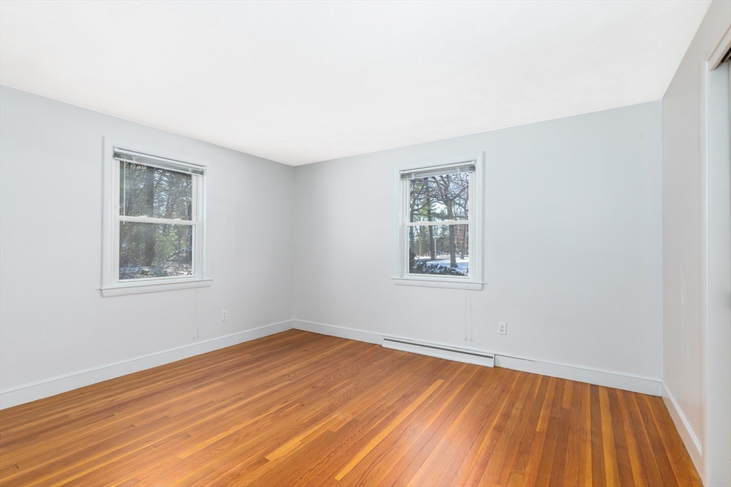 24 Pomeroy Road, Unit 24 North Reading, MA 01864 - Photo 8 of 21 a view of empty room with wooden floor and fan