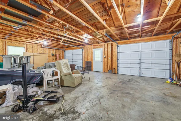 a view of a house with a yard porch and sitting area