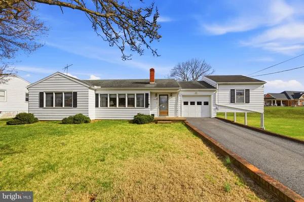 a front view of a house with swimming pool