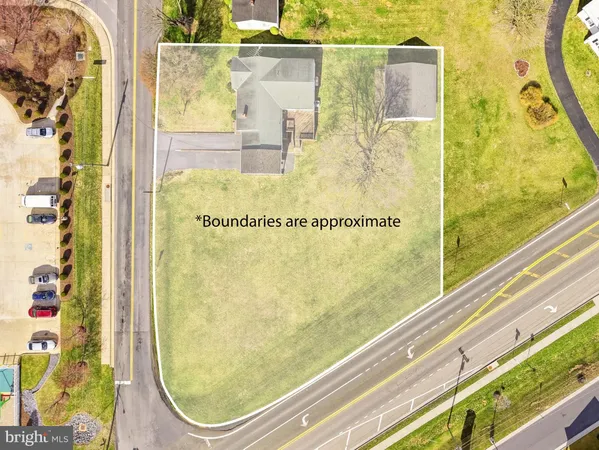 a living room with furniture and a lamp