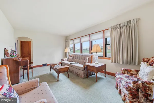 a kitchen with a stove a sink and a refrigerator