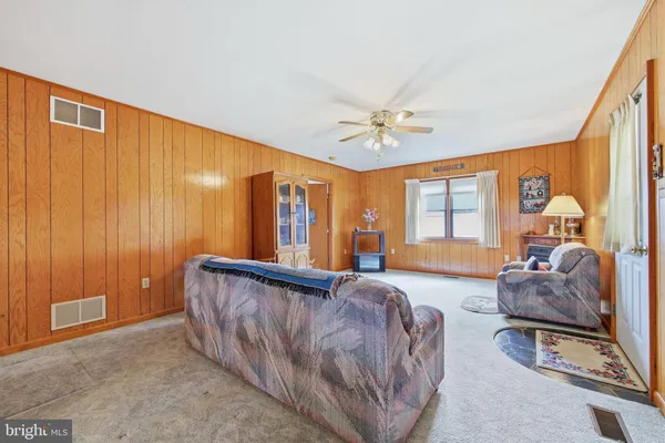 a kitchen with stainless steel appliances granite countertop a sink refrigerator and cabinets