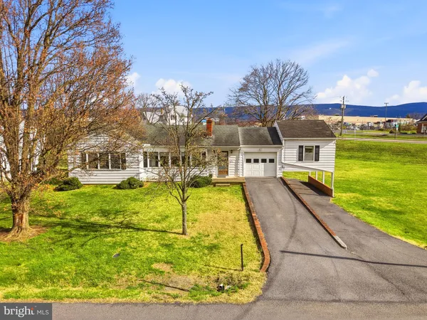a swimming pool with trees in front of it