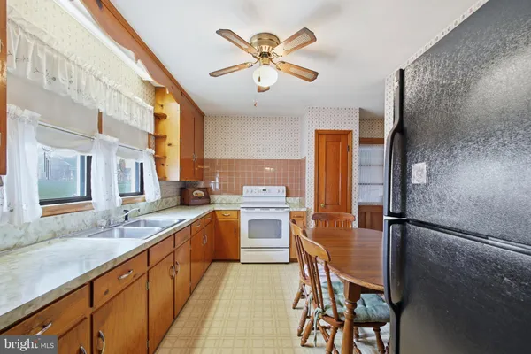 a bedroom with a bed couch and window
