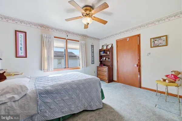 a very nice looking living room with a large window