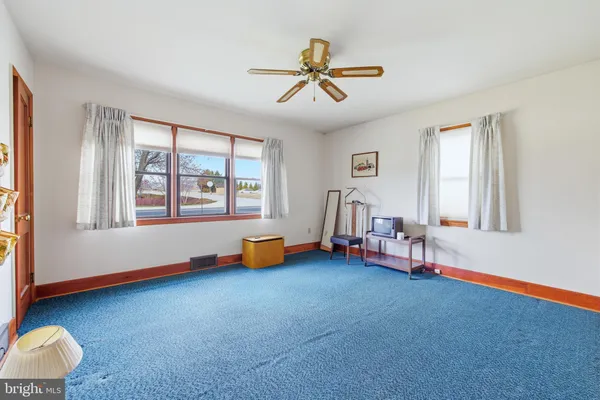 a view of a storage room with water heater and racks