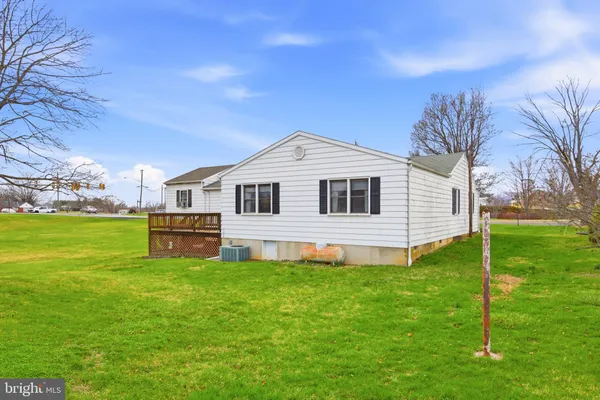 a big white house with a white fence