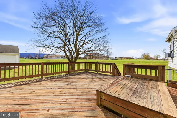 a view of a wooden deck with a bench