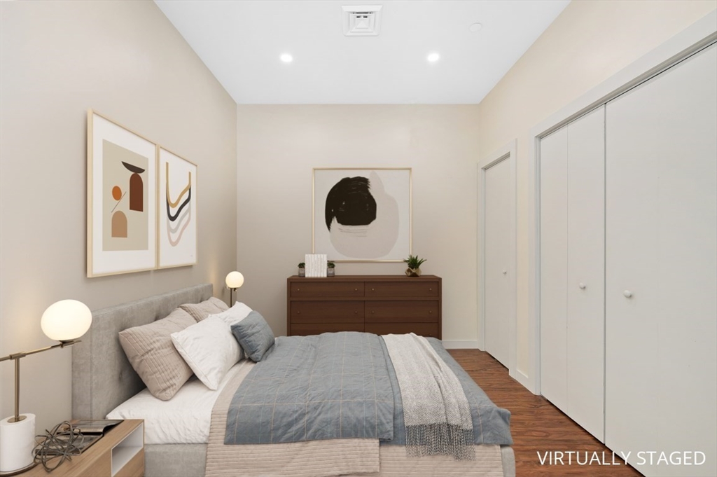 45 1st Avenue, Unit 406 Boston, MA 02129 - Photo 7 of 13 a bedroom with a bed and painting on the wall