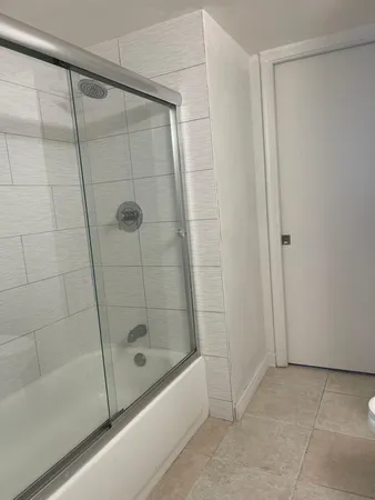 a bathroom with a shower and a bathtub