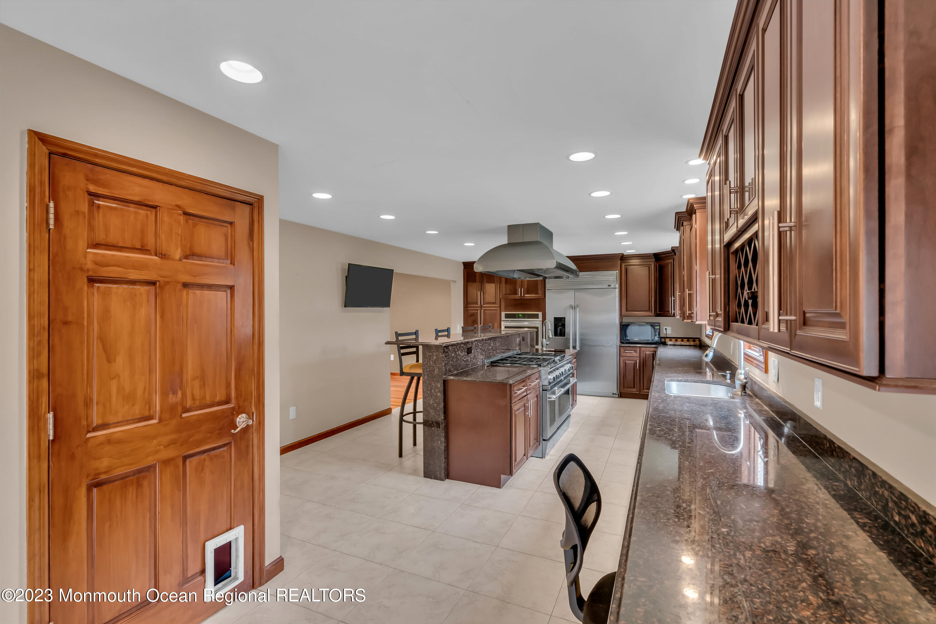 497 Leesville Road Jackson, NJ 08527 - Photo 11 of 25 a view of a kitchen with stainless steel appliances granite countertop lots of counter top space