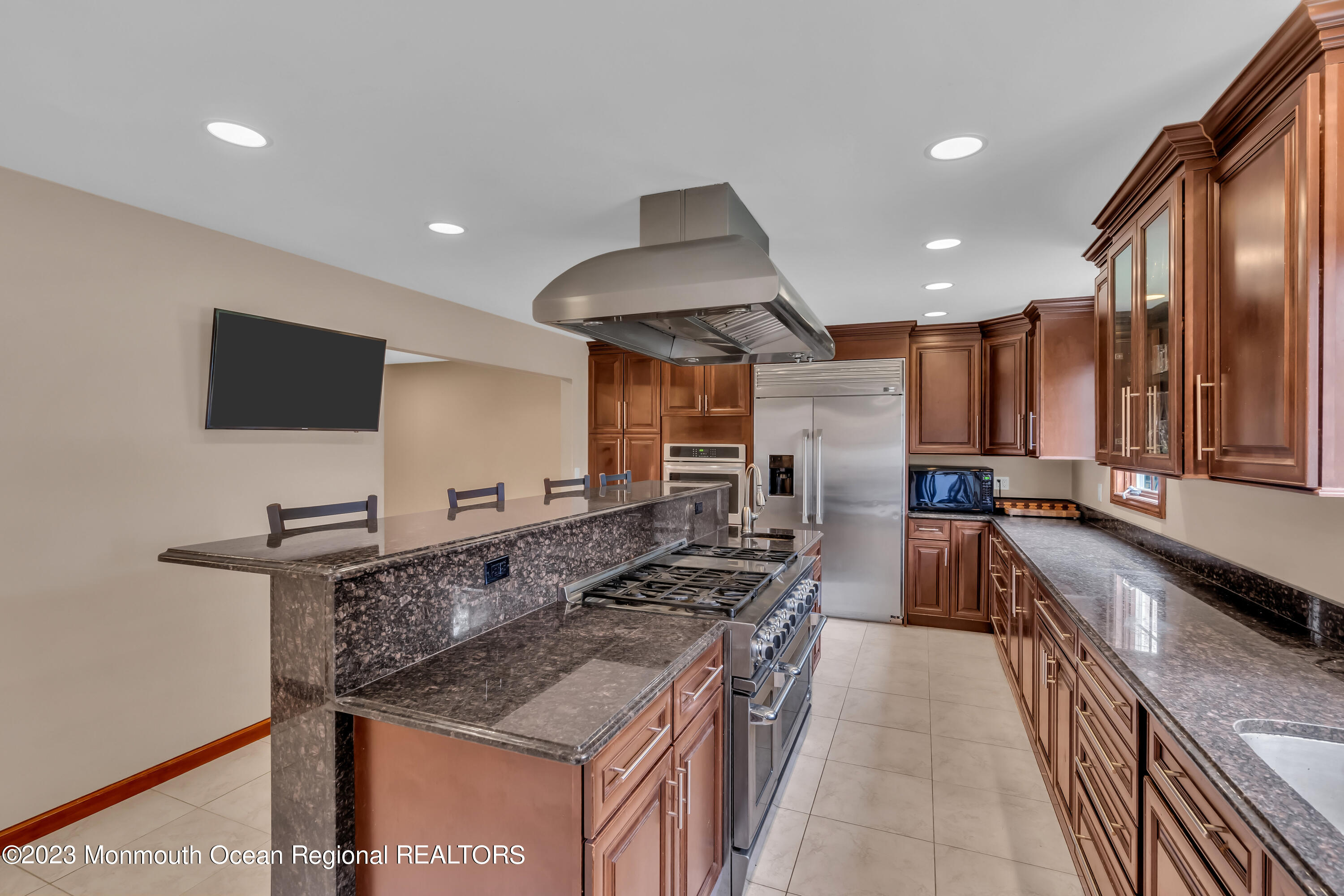 497 Leesville Road Jackson, NJ 08527 - Photo 12 of 25 a kitchen with stainless steel appliances granite countertop a sink stove and refrigerator