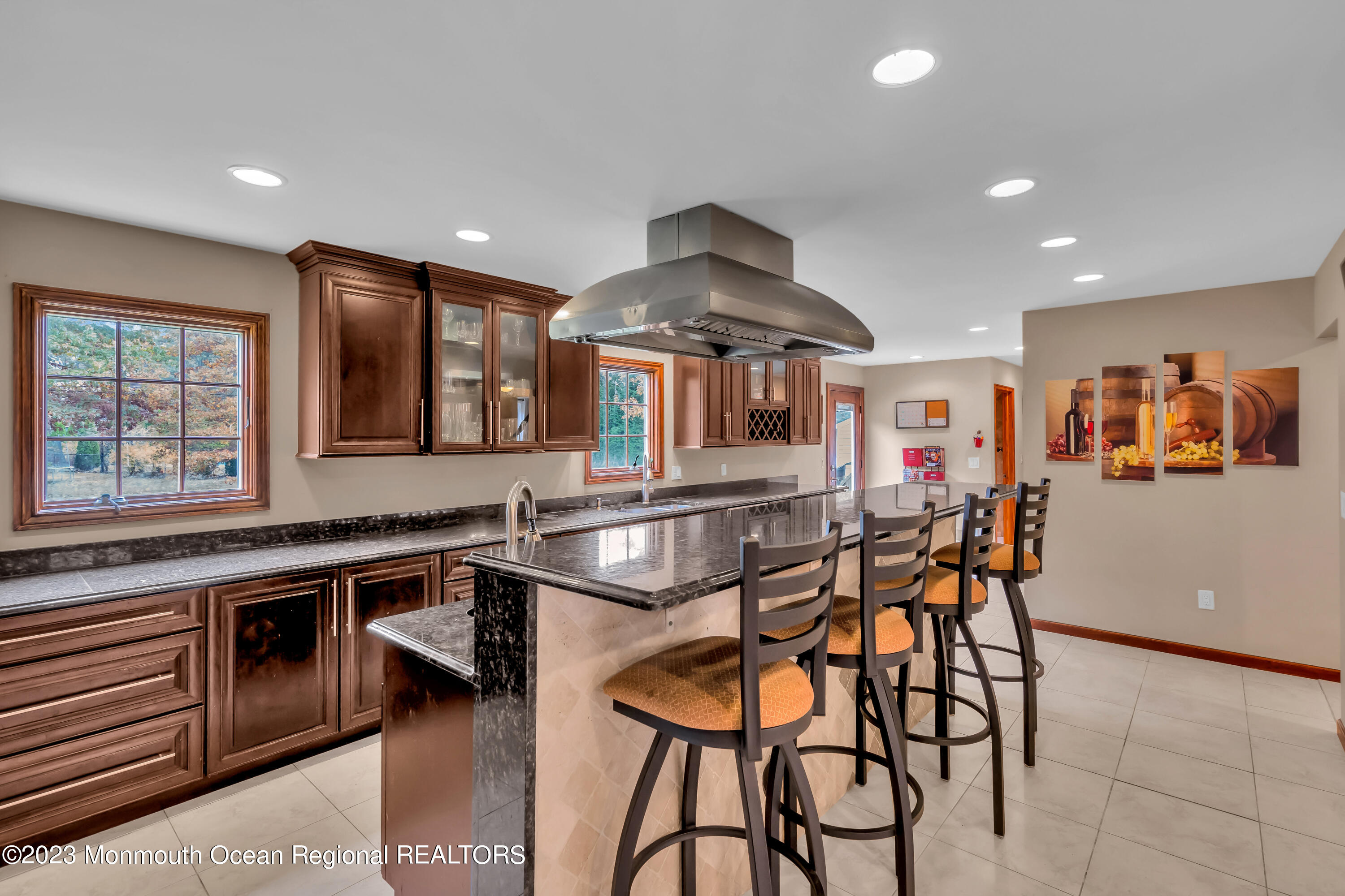 497 Leesville Road Jackson, NJ 08527 - Photo 14 of 25 a kitchen with stainless steel appliances granite countertop table chairs sink and cabinets