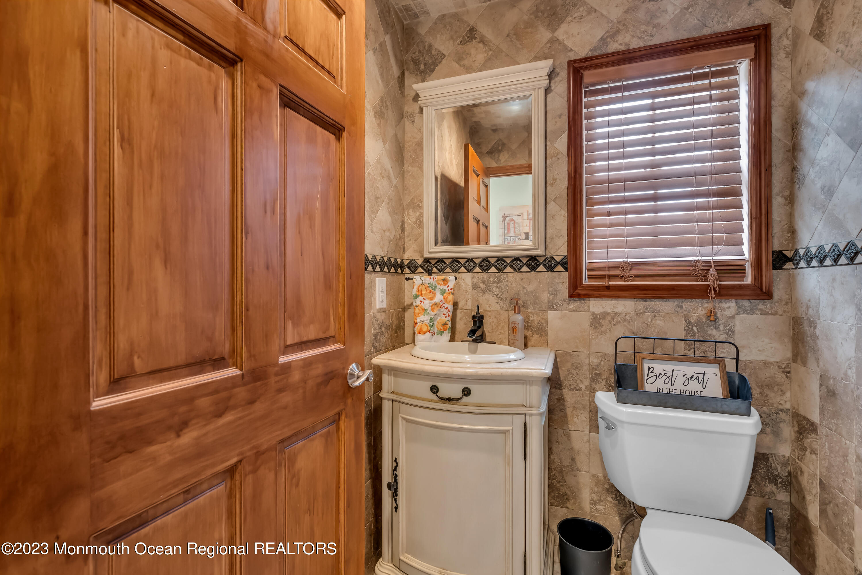 497 Leesville Road Jackson, NJ 08527 - Photo 17 of 25 a bathroom with a toilet a sink and a window