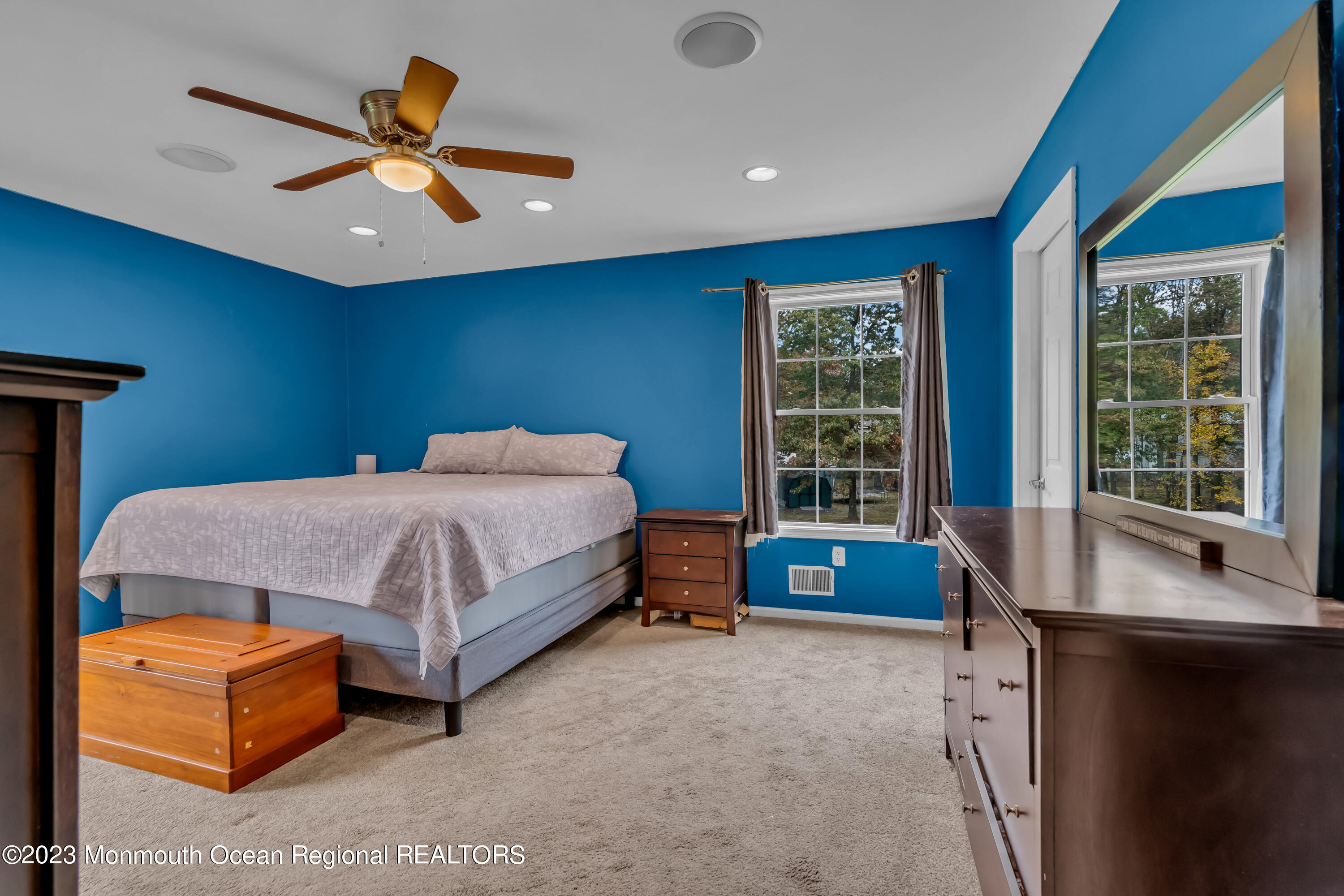 497 Leesville Road Jackson, NJ 08527 - Photo 18 of 25 a bedroom with a bed and a large window