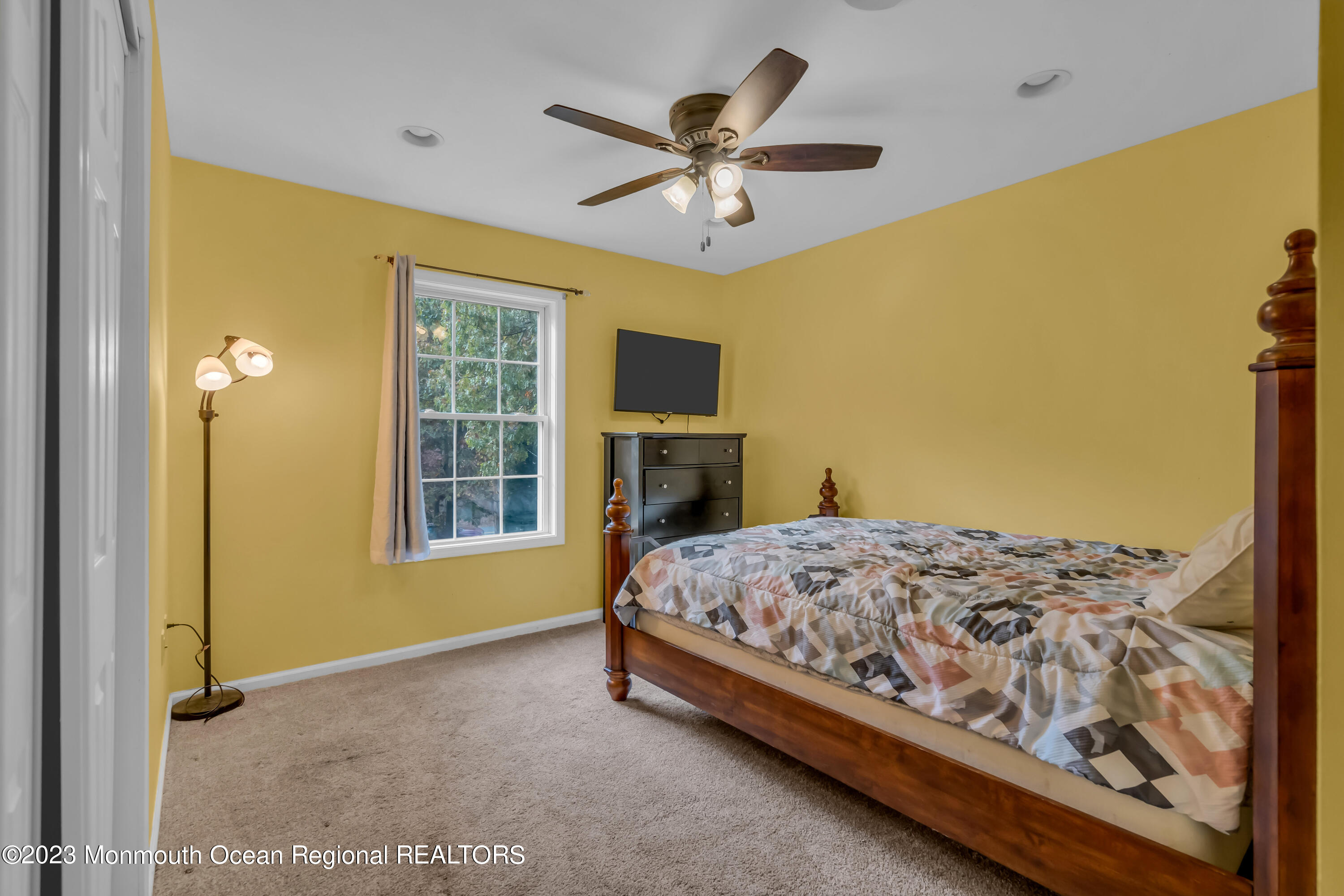 497 Leesville Road Jackson, NJ 08527 - Photo 20 of 25 a bedroom with a bed and wooden floor