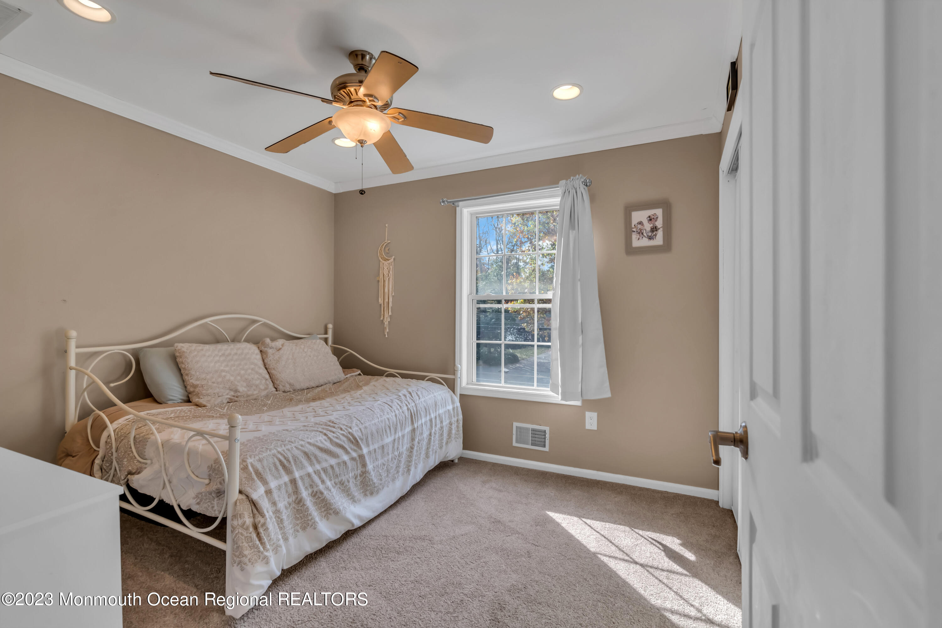 497 Leesville Road Jackson, NJ 08527 - Photo 21 of 25 a spacious bedroom with a bed and a window