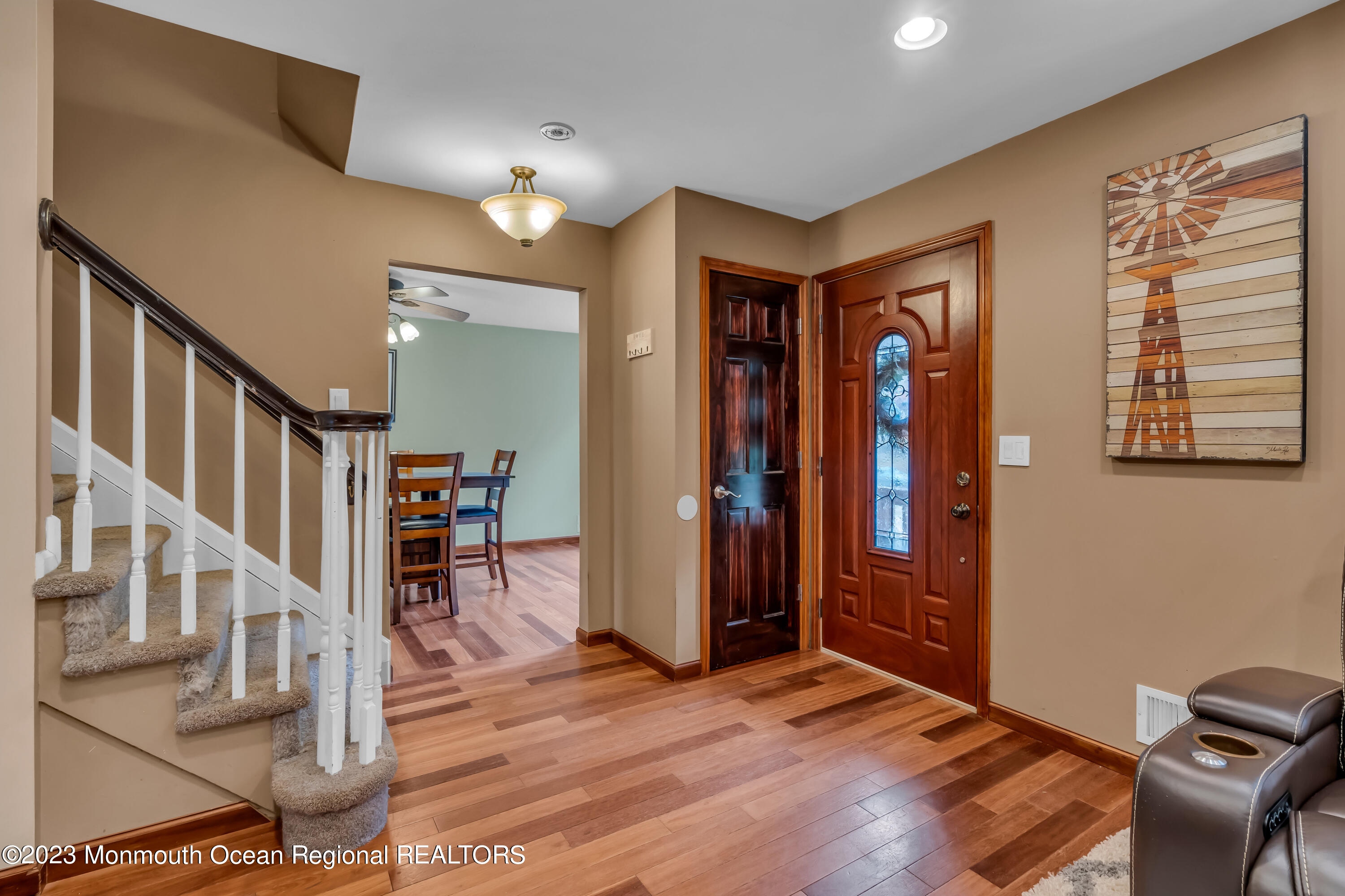 497 Leesville Road Jackson, NJ 08527 - Photo 4 of 25 a view of a livingroom with furniture and stairs