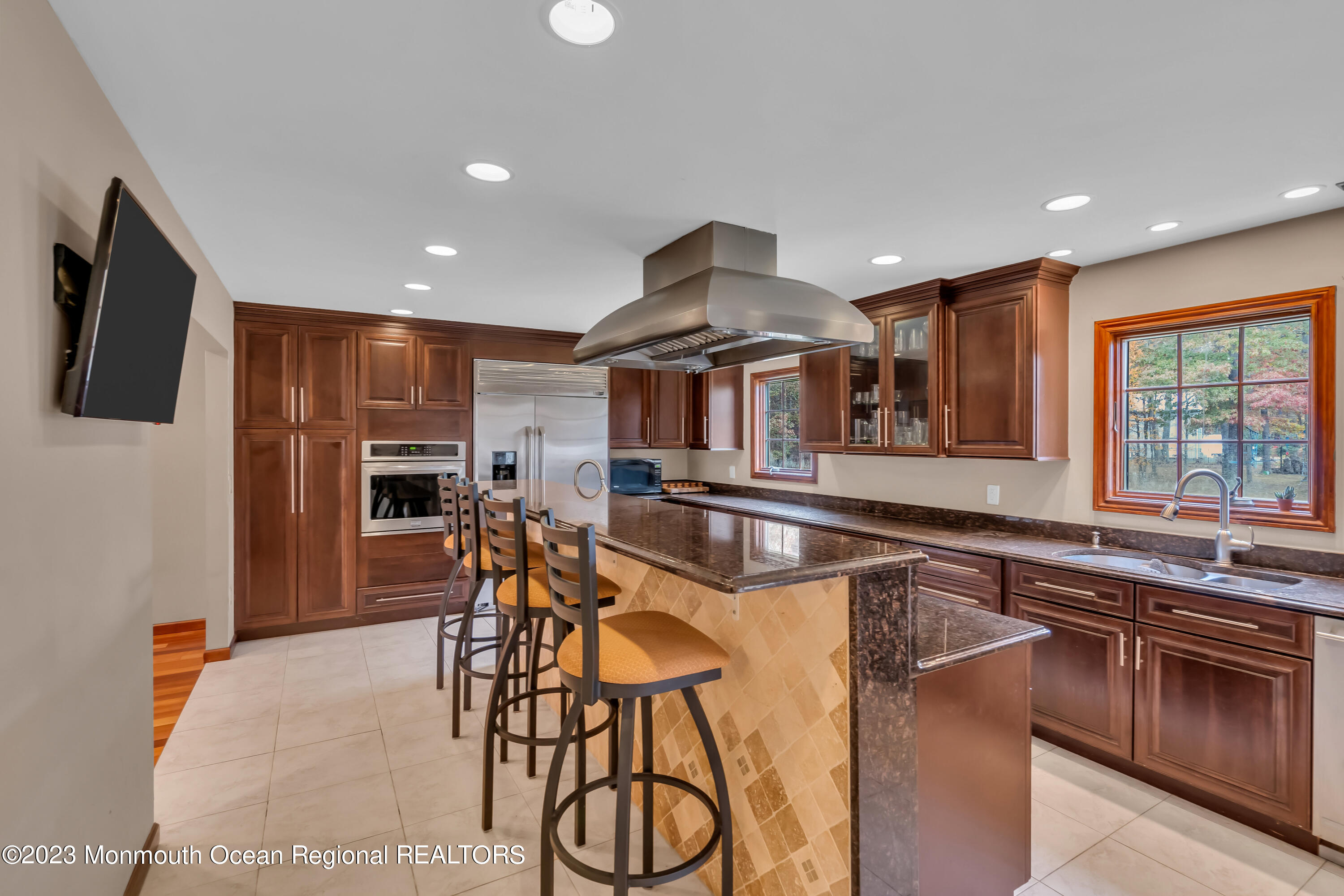 497 Leesville Road Jackson, NJ 08527 - Photo 10 of 25 a large kitchen with stainless steel appliances granite countertop a stove and a sink