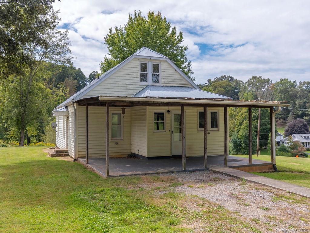 793 Morning Star Road Canton, NC 28716 - Photo 21 of 24 front view of a house with a yard