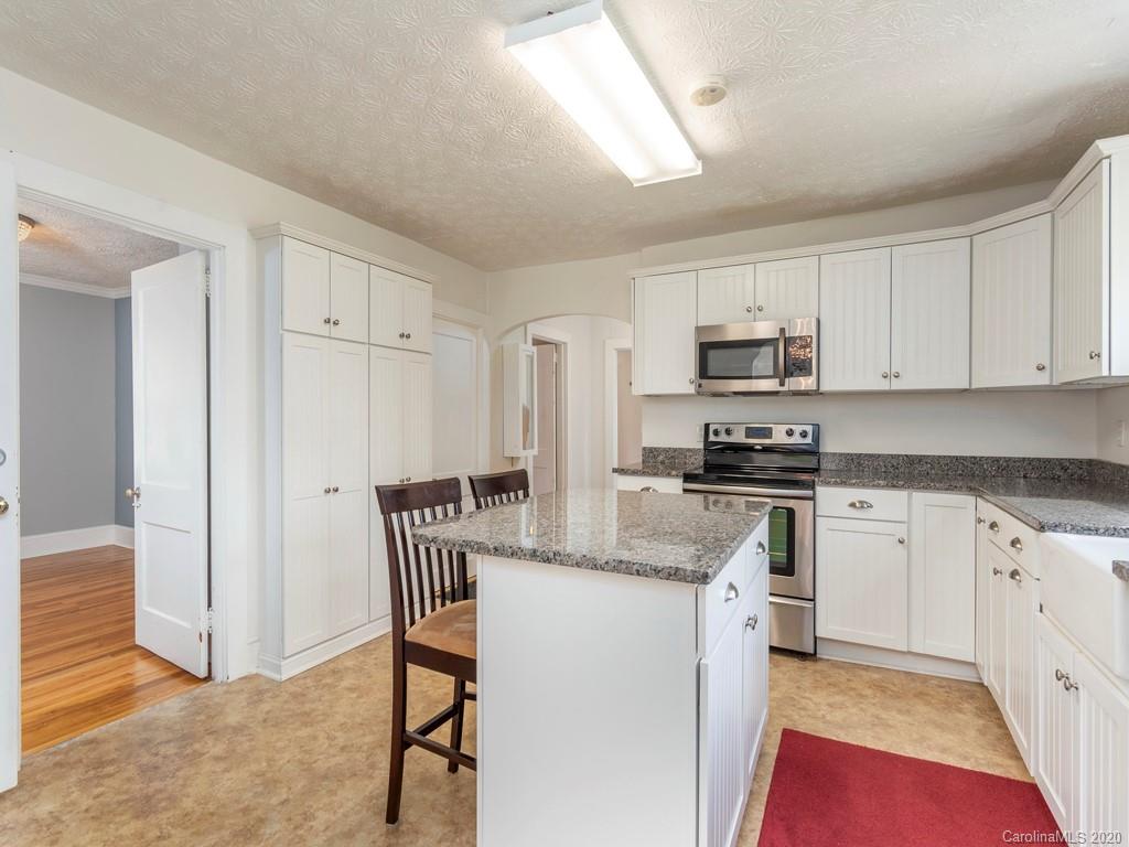 793 Morning Star Road Canton, NC 28716 - Photo 10 of 24 a kitchen with stainless steel appliances granite countertop a stove a sink and a refrigerator