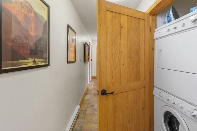 a view of a hallway with washer and dryer