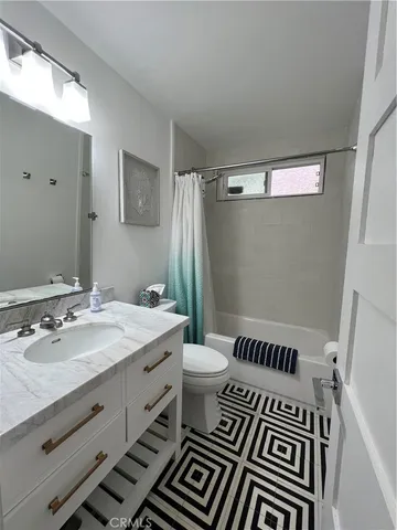 a bathroom with a double vanity sink and mirror