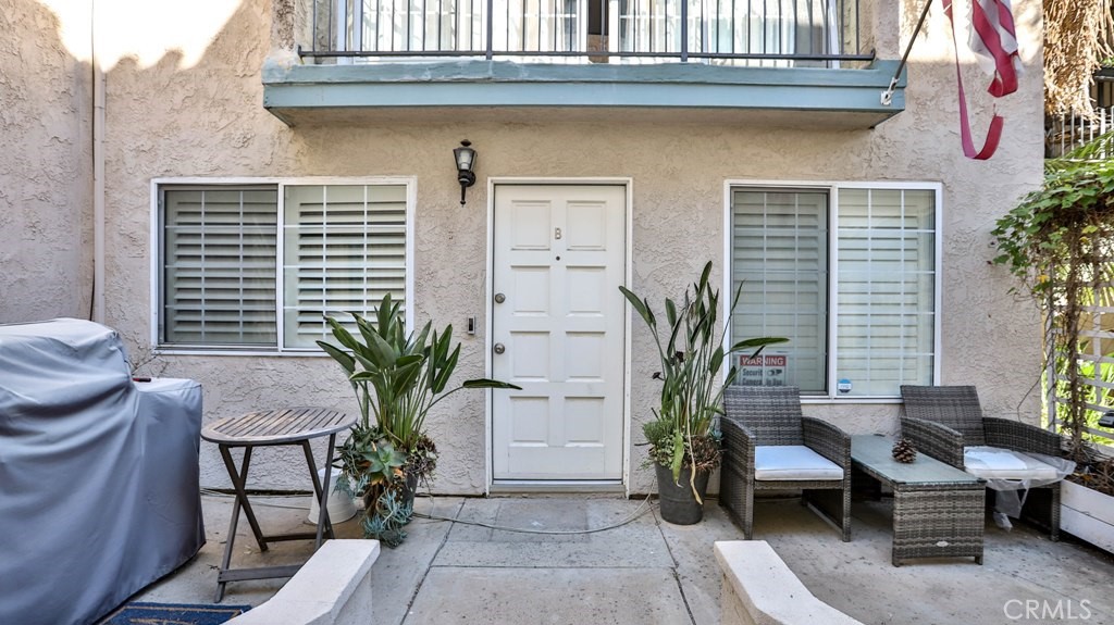 218 16th Street, Unit B Huntington Beach, CA 92648 - Photo 2 of 14 a view of a house with a potted plant and sitting area
