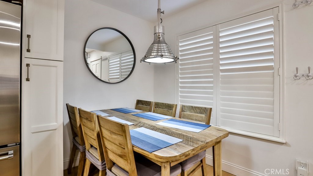 218 16th Street, Unit B Huntington Beach, CA 92648 - Photo 8 of 14 a view of a room that has a table and a chair