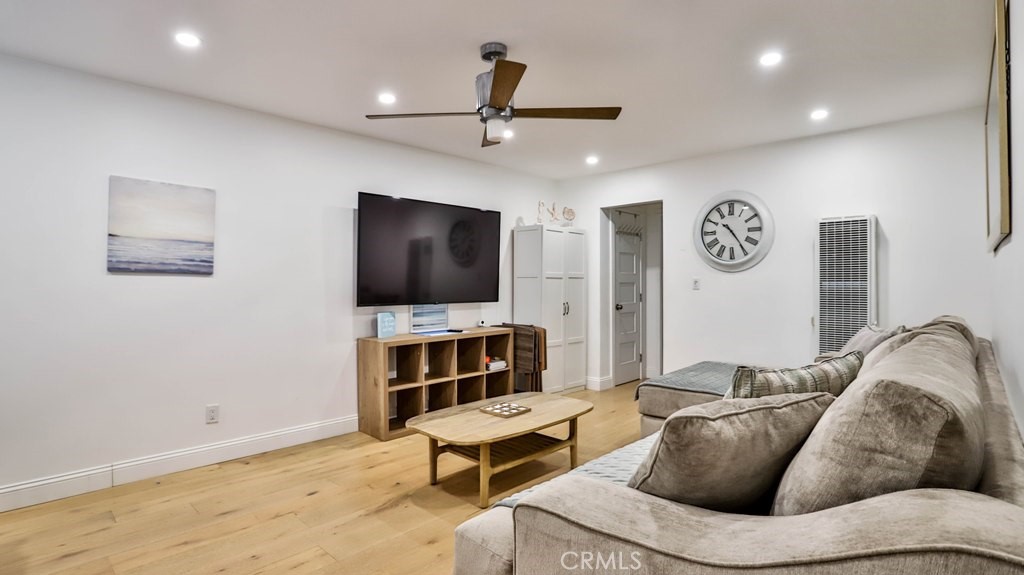 218 16th Street, Unit B Huntington Beach, CA 92648 - Photo 9 of 14 a living room with furniture and a flat screen tv