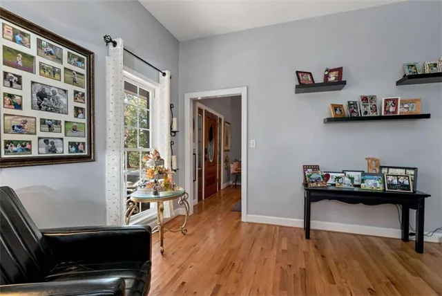 a spacious bedroom with a bed and a dresser