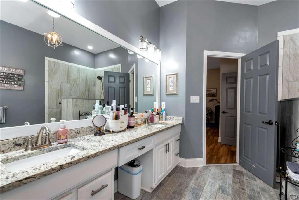51 Howiington Road Jefferson, GA 30549 - Photo 23 of 81 a bathroom with a double vanity sink and a mirror