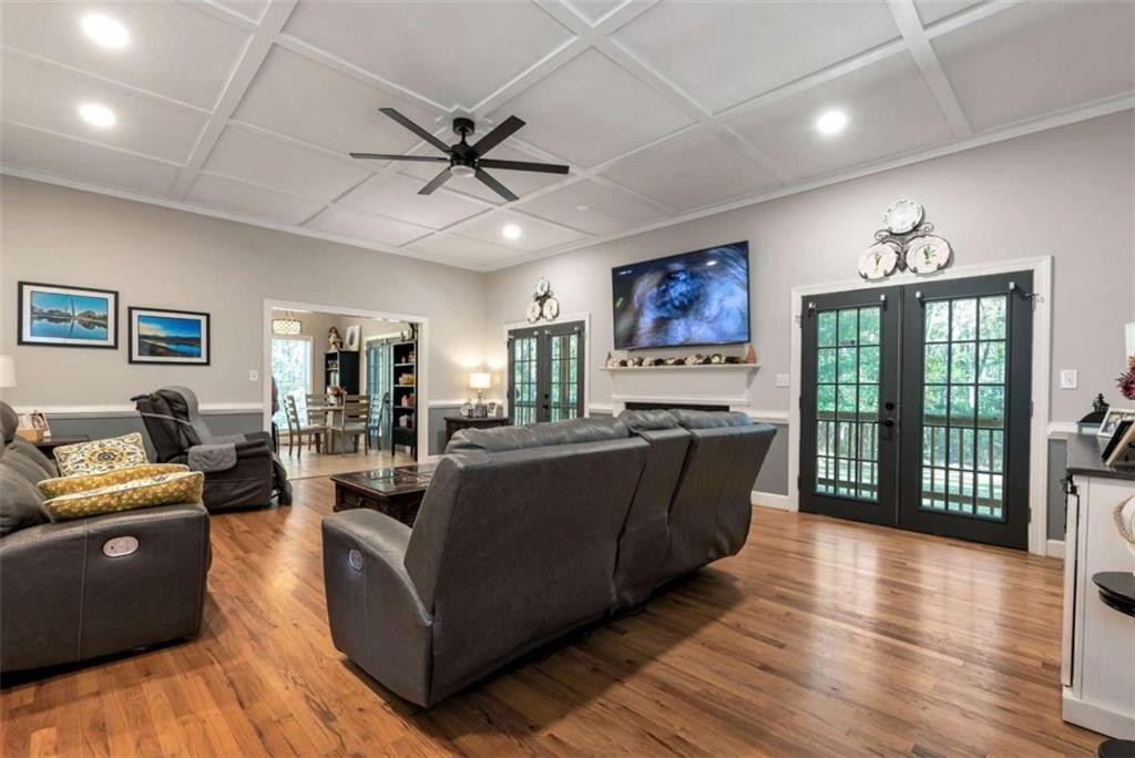 51 Howiington Road Jefferson, GA 30549 - Photo 27 of 81 a living room with furniture a large window with kitchen view